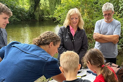 Liz Jarvis MP testing river water with volunteers